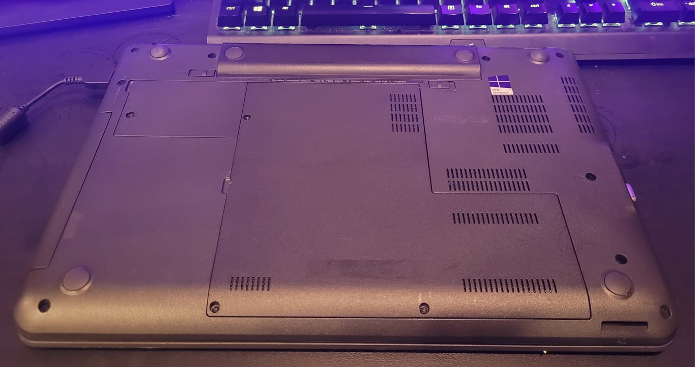 Bottom of Lenovo ThinkPad E560 laptop showing its exterior condition